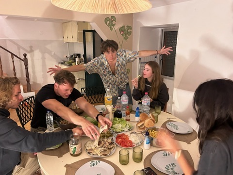 Friends gathered around a dinner table