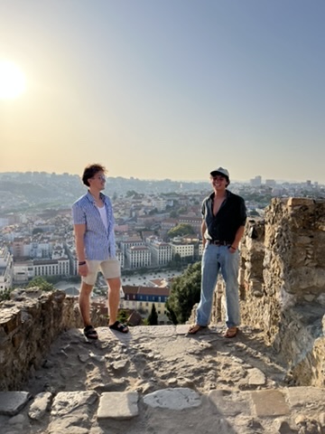 Students standing on stone ruins